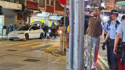 西環Tesla男司機疑交通違例　與警員爆粗爭執　舉中指罵途人