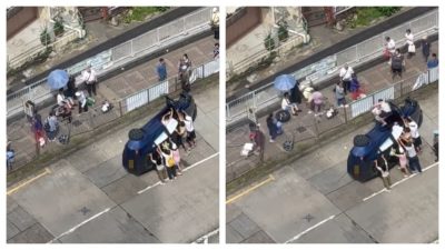 大埔Tesla撞欄翻側 車轆飛脫司機被困 多名熱心巿民扶車身助脫險